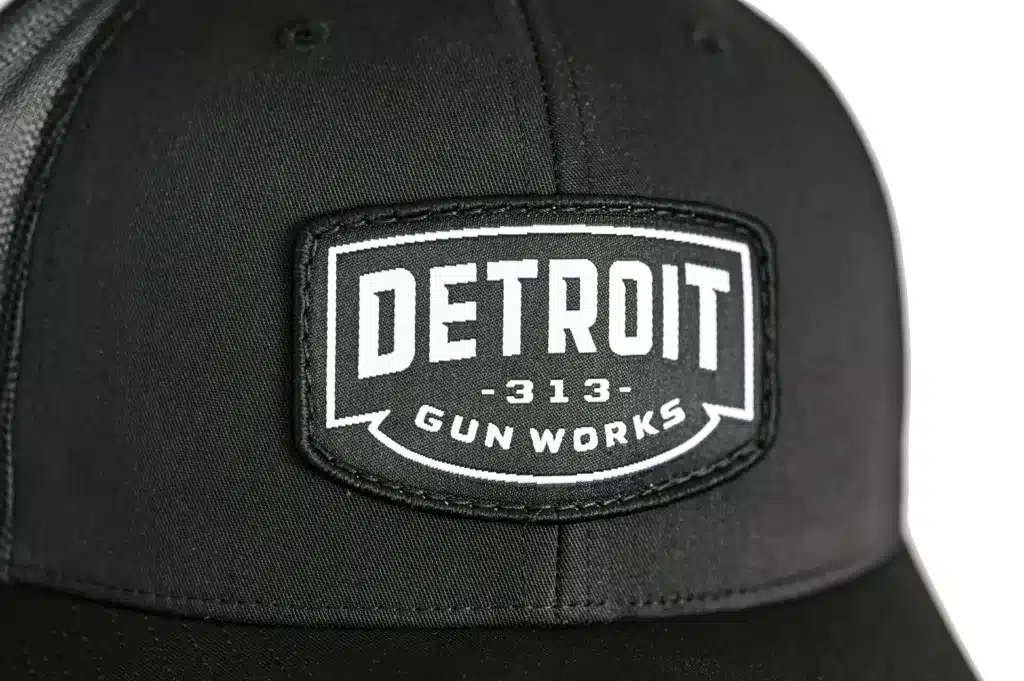 Closeup of badge of DGW Badge Trucker Hat