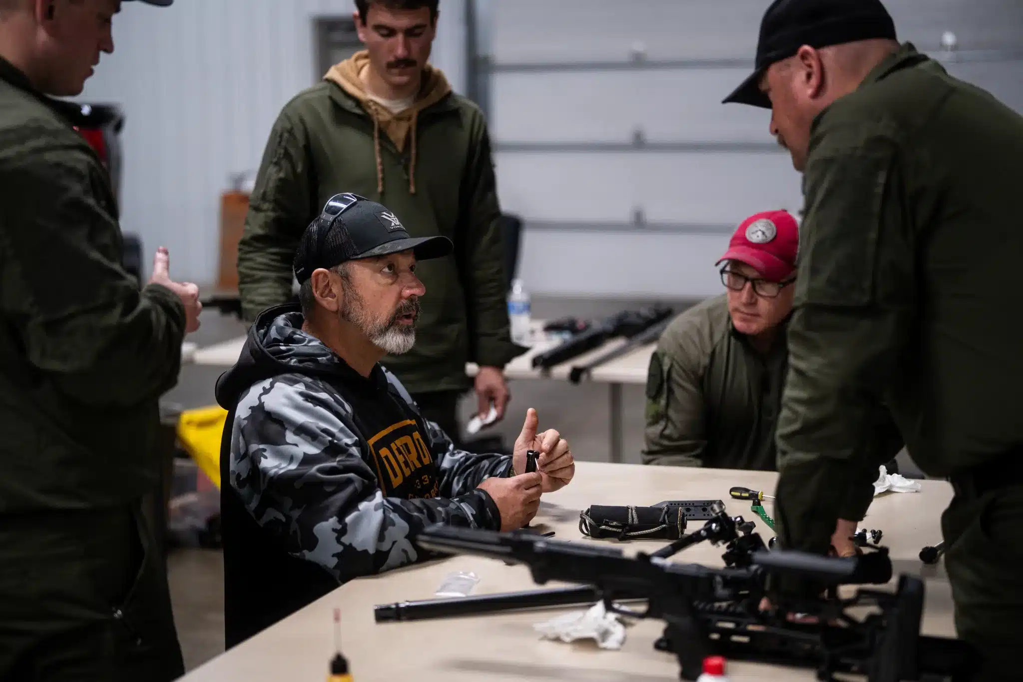 walden instructing a dgw armorer's course for detroit gun works bolt guns